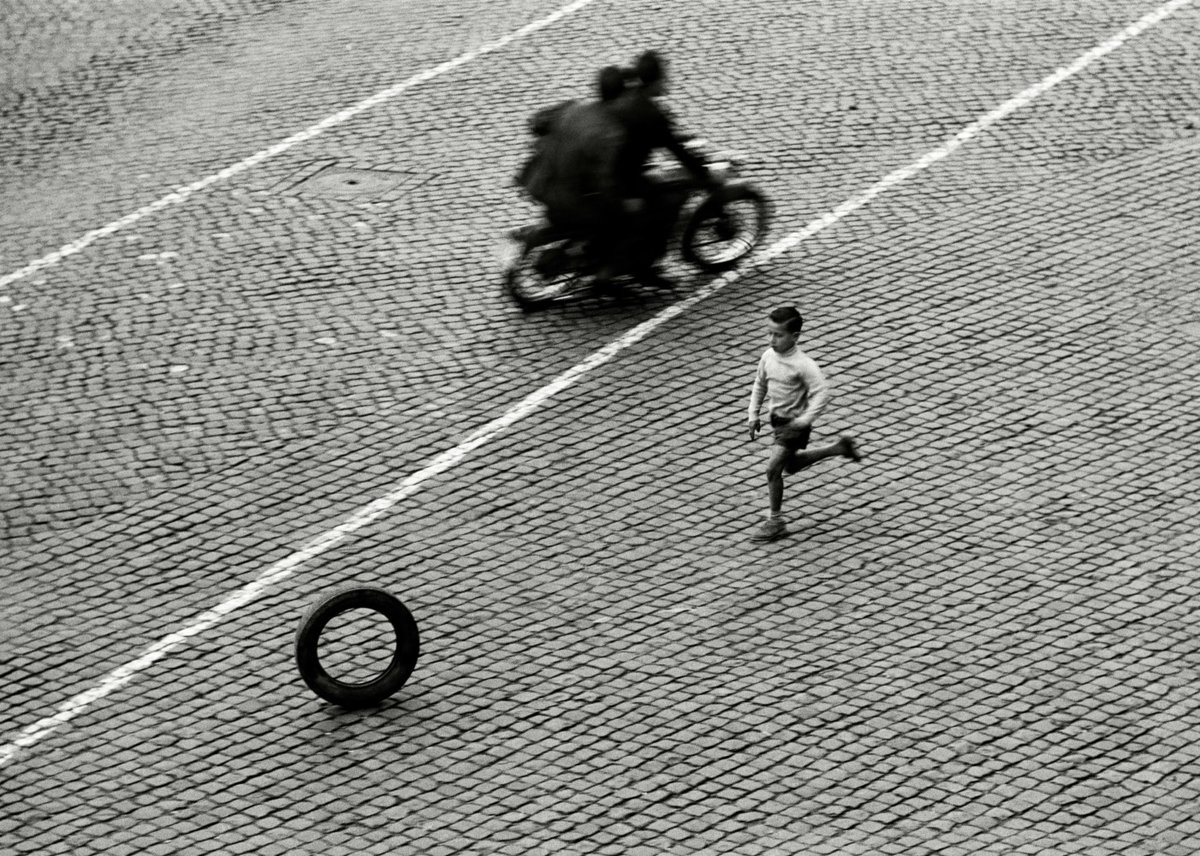 Herbert List.Playing With a Tire., Rome 1953.Scolding for the lost tire. Rome 1953
