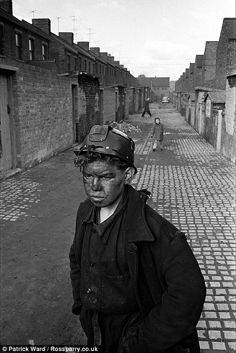 In the 1960s, Patrick Ward documented the mining communities of County Durham and Cumbria, giving a glimpse of life inside and out of the pits. Here are some of those images. .A teenager miner in Horden heads home after finishing his shift.