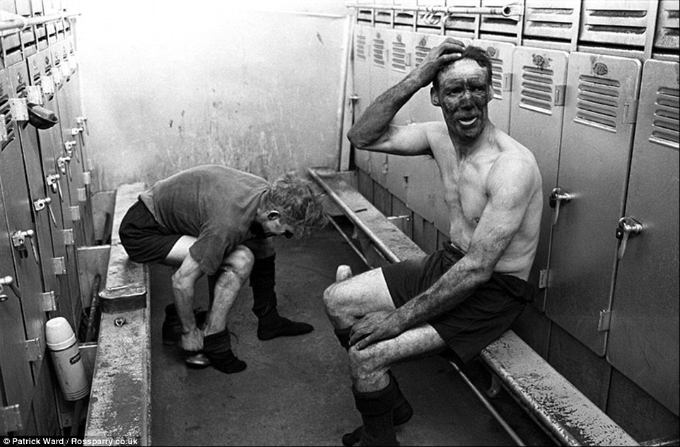 Miners get changed out of their work clothes in one of the locker rooms at Horden Colliery