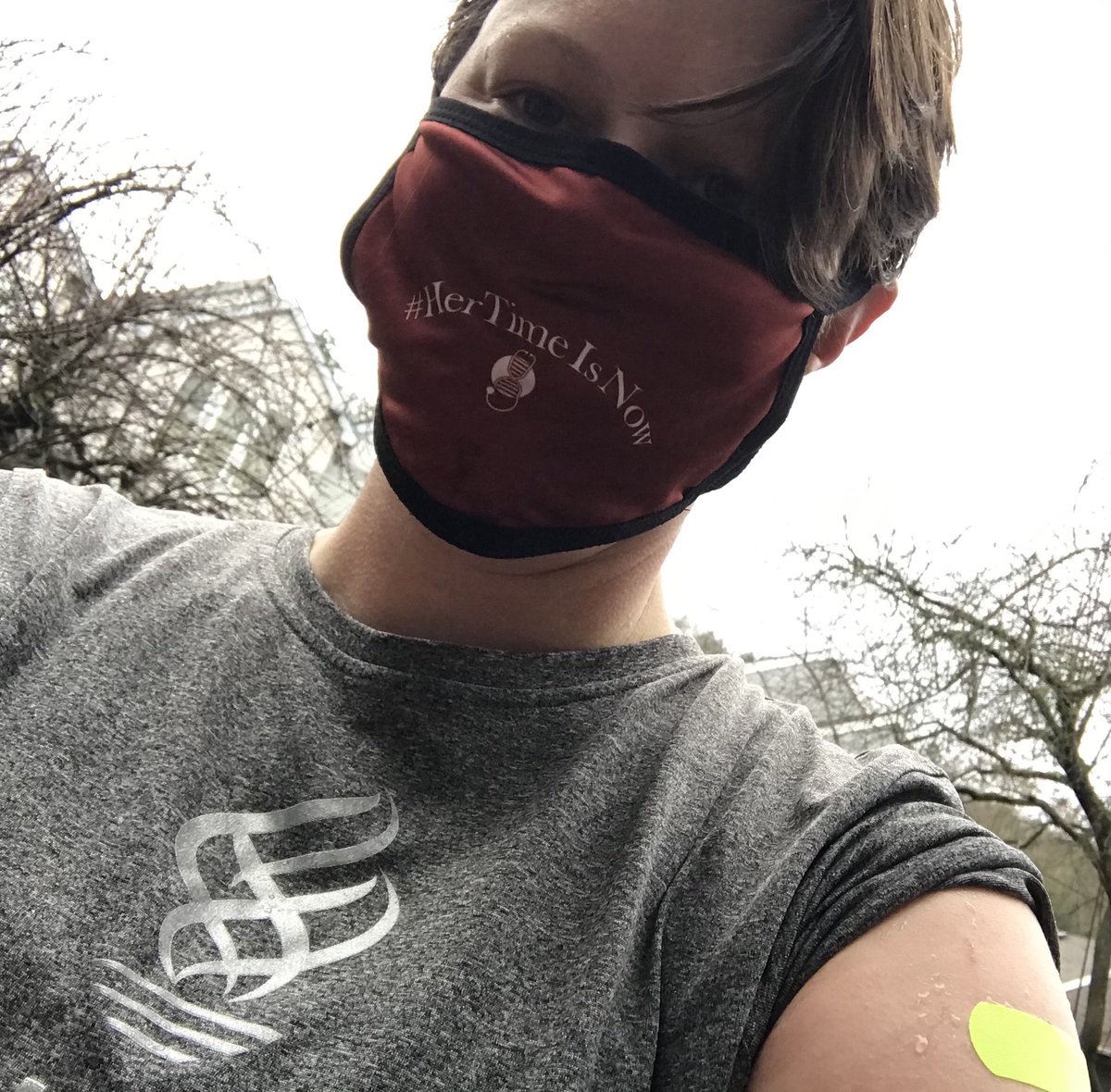 MollieMarr's tweet image. Covid vaccine followed by a rainy #ComebackRun with ⁦⁦@bennettrun⁩ 

[Mollie wearing mask reading “Her time is now” standing outside post run with left sleeve rolled up showing a bright yellow bandaid]