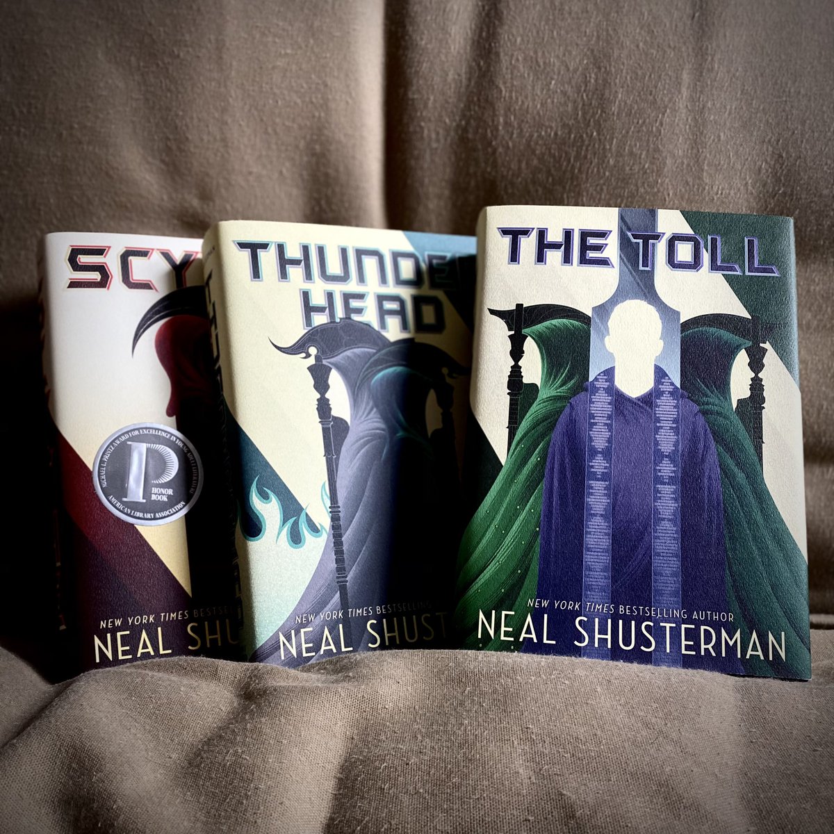 LundLibrarian's tweet image. Last #bookgiveaway this year... a hardcover set of the ARC OF A SCYTHE trilogy! I have a hard time keeping this thrilling YA series on my library shelves — oh, and did I mention THE TOLL is autographed?! Follow/RT to enter, US only, winner announced January 1st.