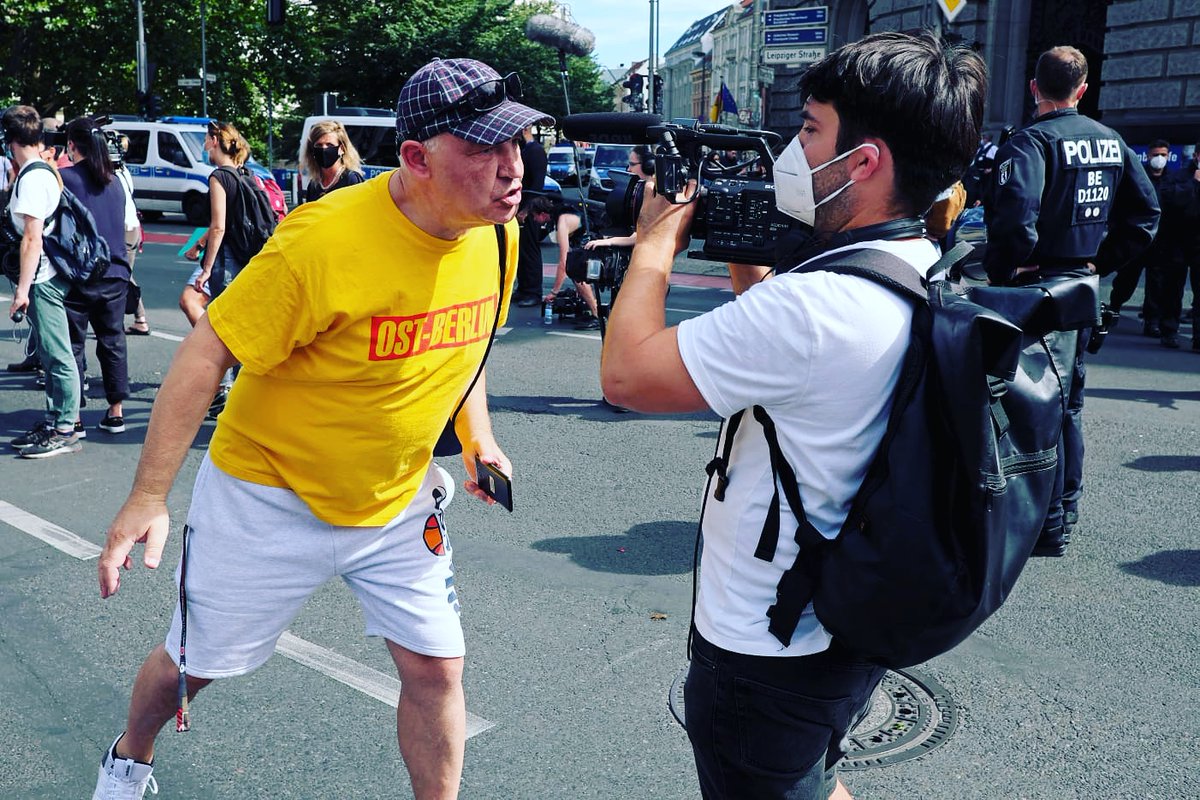 #hrowback to one of the crazy shoots in 2020: .<a href="/Ro_Ack/">Robert Ackermann</a> filming at a "Querdenken" demonstration in summer for <a href="/dunjahayali/">Dunja Hayali</a>. Thousands of anti-maskers, conspiracy theorists &amp; far-right activists gathered in Berlin to protest against government measures to contain the #coronavirus