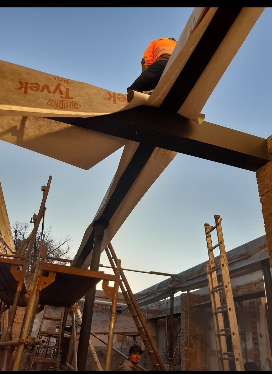 We installed the big timbers for the Biergarten roof but there wasn't time to finish it before winter, so they had to be painted and protected in a hurry.