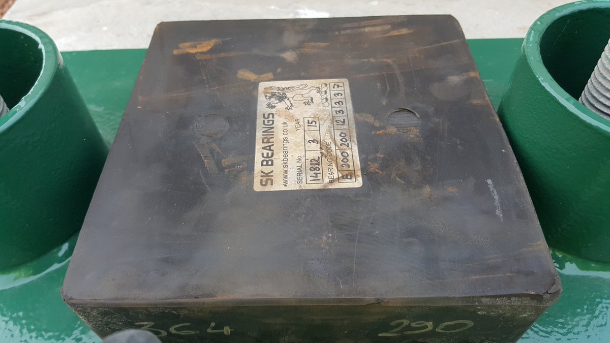 Elastomeric bearings are made of engineered rubber, sometimes with steel plates built in. Here they are being used to support a metal footbridge. These are just rubber pads and so don't restrict movement at all - they are free-range bearings.