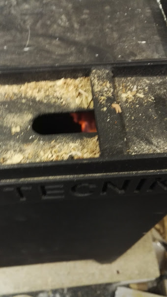 I finally installed a shavings burner in the workshop. Not only does it mean my fuel is effectively free, but it also serves as a coffee maker...and I'm warm in the workshop for the first time