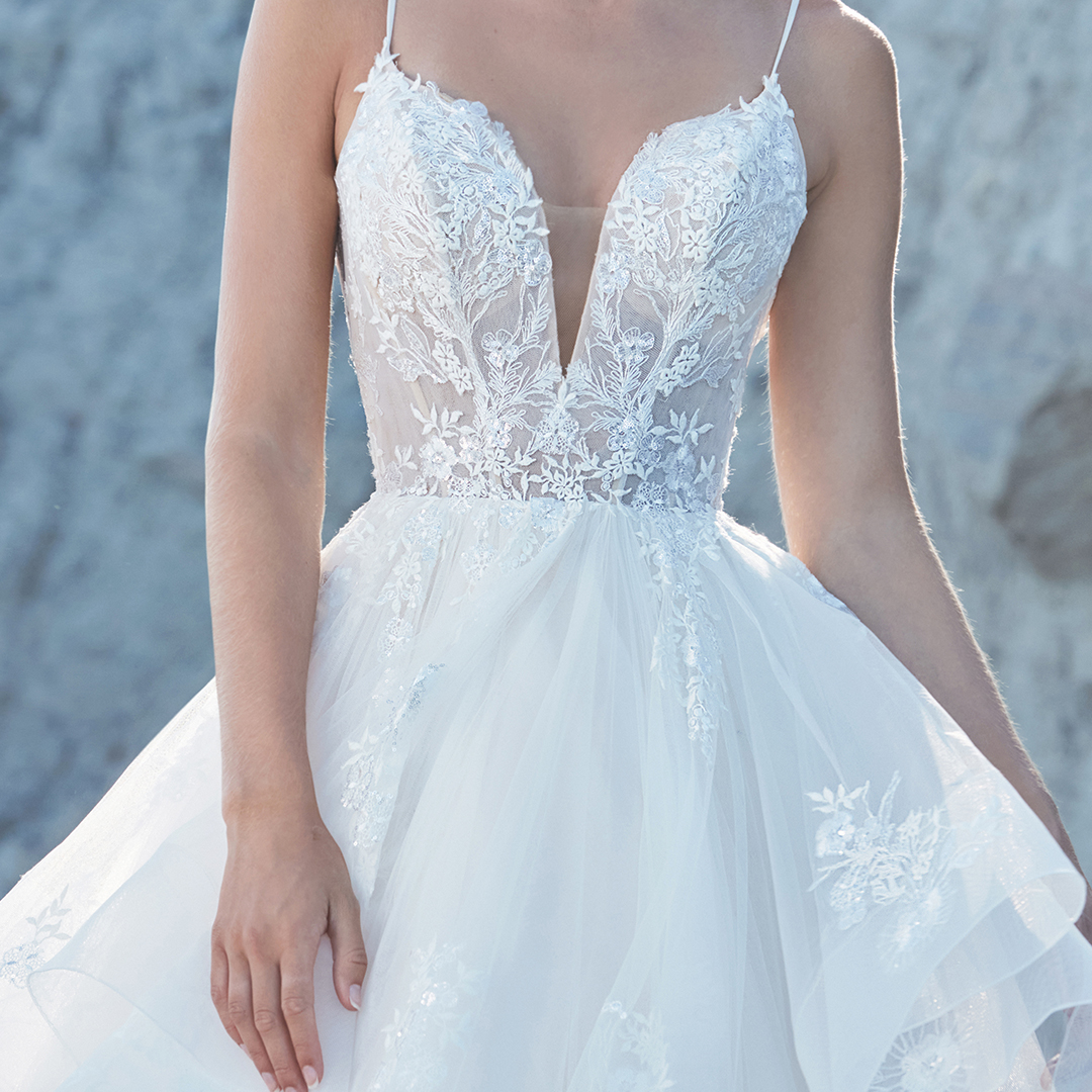 Ivory lace, dreamy tulle &amp; a splash of magic make Rosa~LA21115 a truly romantic #ballgown #weddingdress! 🌹Featuring a corset-style bodice with a #plunging V-neckline, a dreamy tiered skirt, and a matching #veil - your #bridal entrance will be magnificent! ✨