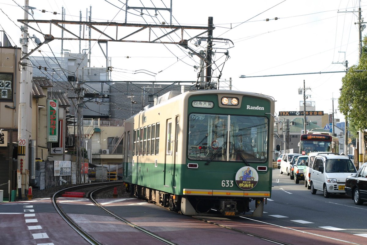 Interurbans had simple infrastructure than mainline railroads: lighter roadbed/bridges, simpler stations, often single track. And when they got to towns, they often ran down the street: cheaper than acquiring dedicated right of way, central to where people were going. (Kyoto)