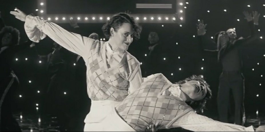 Harry Styles & Phoebe Waller-Bridge from the "Treat People With Kindness" music video.