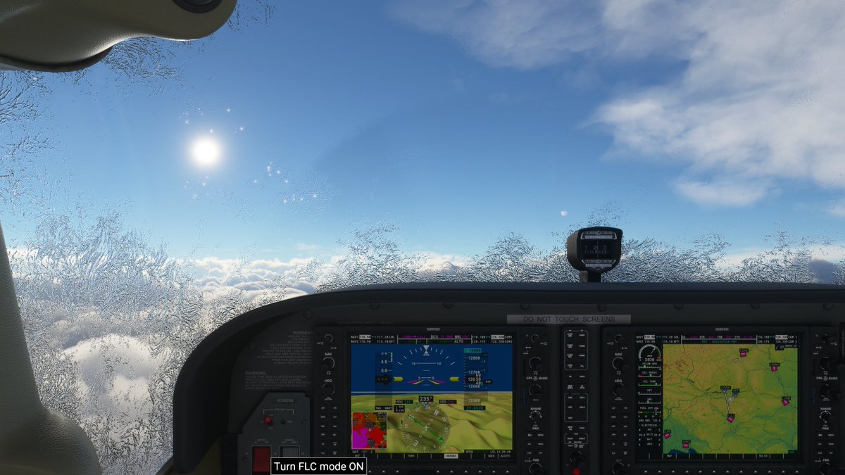 36. I didn't fly through any clouds. But maybe the air pushed up from mountains below carried moisture? In any case, I've got frost forming on my windshield. This is NOT good.