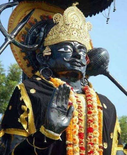 THE KATHA OF SHANI DEVShani literally means the “slow-moving-one”. He is the son of Surya and Chhaya. When he was in his mother’s womb, she was engrossed in penance of Shiva in blazing sun and didn’t even care to have food. So, Shani Dev was born with dark skin.