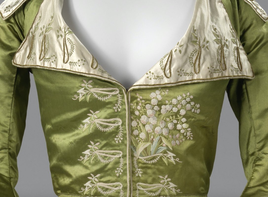 kateStrasdin's tweet photo. The #embroidery design on this #1780s #redingote is remarkable. It has created the illusion of buttonholes out of which, centre left, a spray of lily of the valley springs in asymmetric style. It is a work of art by needle @rijksmuseum #fashionhistory https://t.co/1Zy406dcBd
