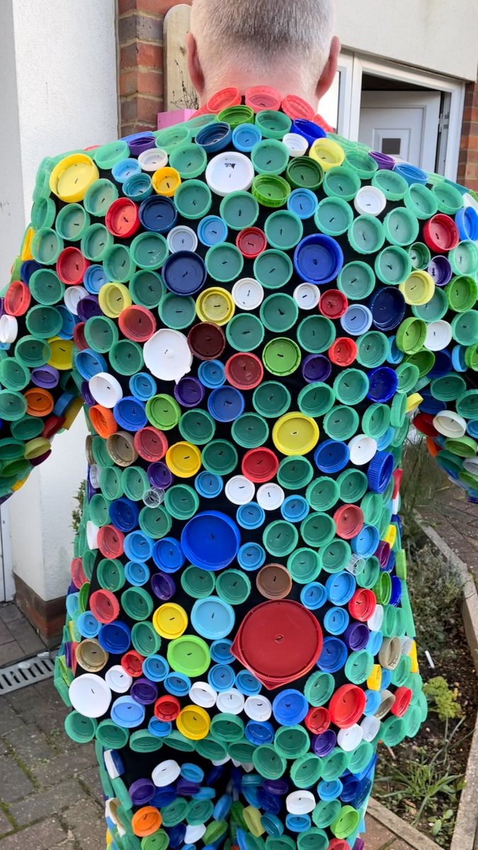 UKrubbishwalks's tweet photo. After days of work and 1,404 plastic bottle tops I’ve finally finished my DRS - Deposit Return Suit! I was gutted to hear that the Deposit Return Scheme in England has been delayed until 2024. This isn’t good enough... https://t.co/hBFWiEoRPq