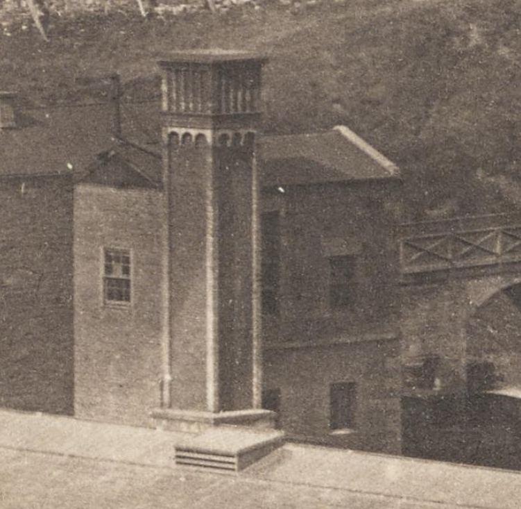 The tunnel is under the red arrow, there is a footbridge across to the booking hall/ waiting rooms from steps accessing Princes Street, and under the green arrow is the distinctive tall building and ornate chimney of the winding house, which hauled trains up the tunnel on a rope