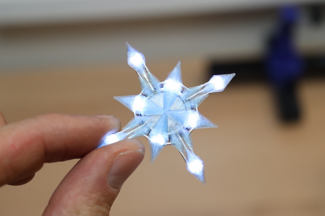 jipraus's tweet image. My daughter asked me to create a Frozen style pendant for her. ❄️ I printed out the crystal shape using @Fillamentum's Ice Blue Crystal Clear PLA and added some cold white LEDs on the back.