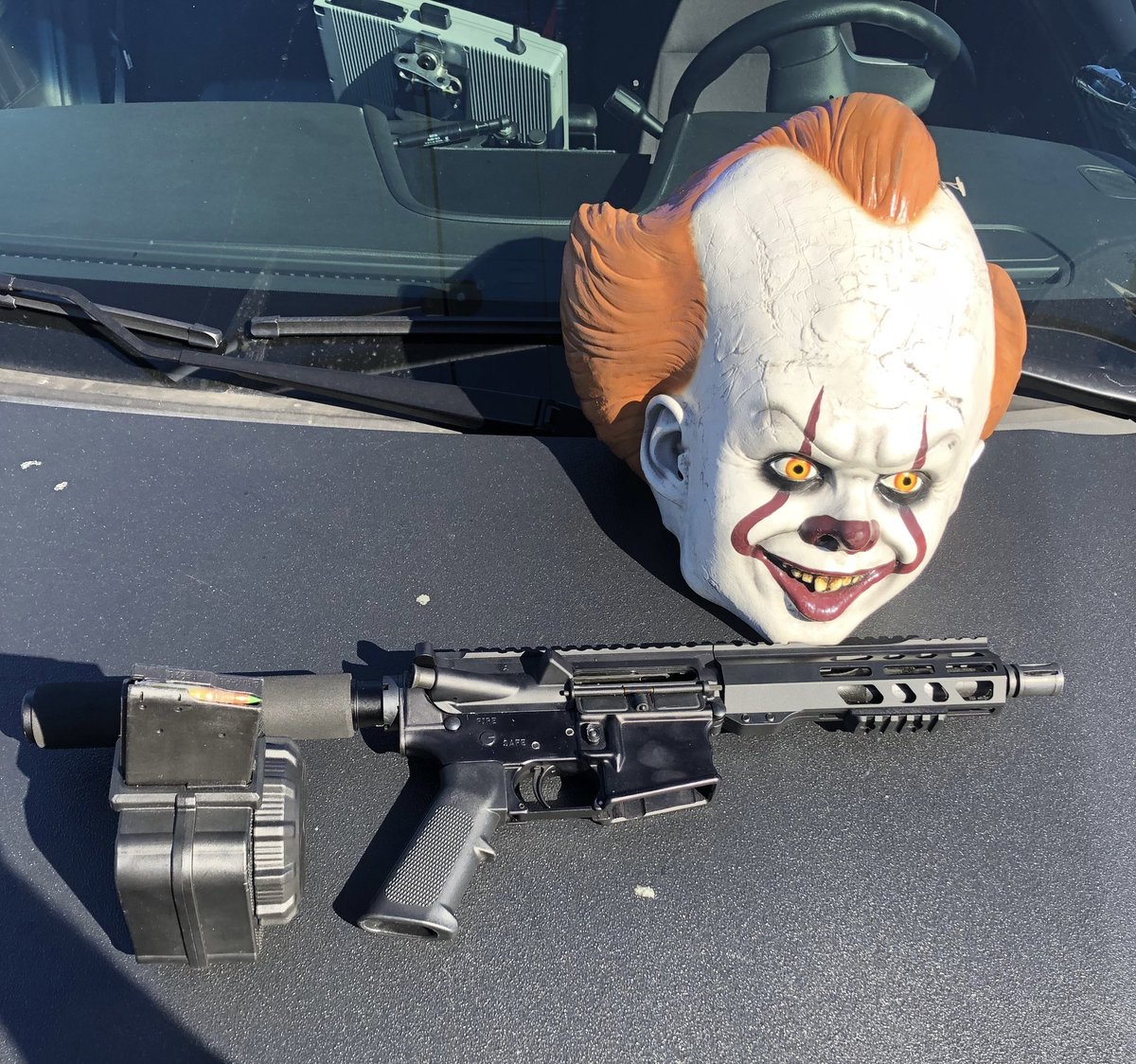 2 of 3
Firearm Arrest
The AR-15 had a 50 Round Drum Magazine with one bullet in the chamber.  We also recovered an “It” Clown Mask and marijuana in the vehicle.  The suspect was arrested and transported to jail and booked on multiple drug and weapons violations.