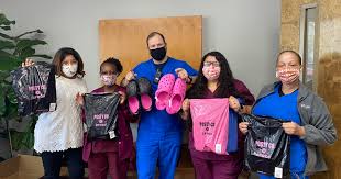 CBSSunday's tweet photo. Post Malone teams up with charity to give away 10,000 pairs of Crocs to healthcare workers https://t.co/EvuCqxVzmk https://t.co/LpAhpvLPhQ