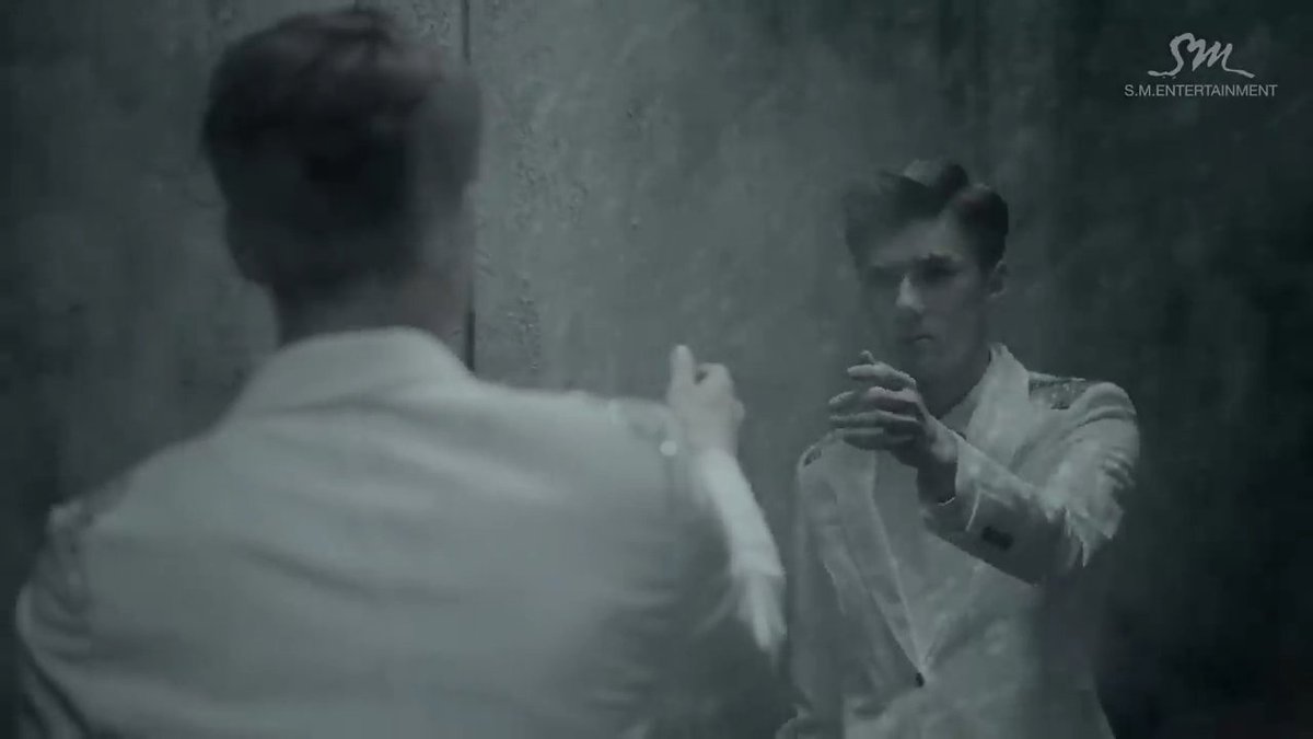 meanwhile in sehun's situation, you can literally see him standing and just reaching out his hand while looking at himself. but when he seemed to do it, he was seen holding the side of his head afterwards, as if what he did triggered something.