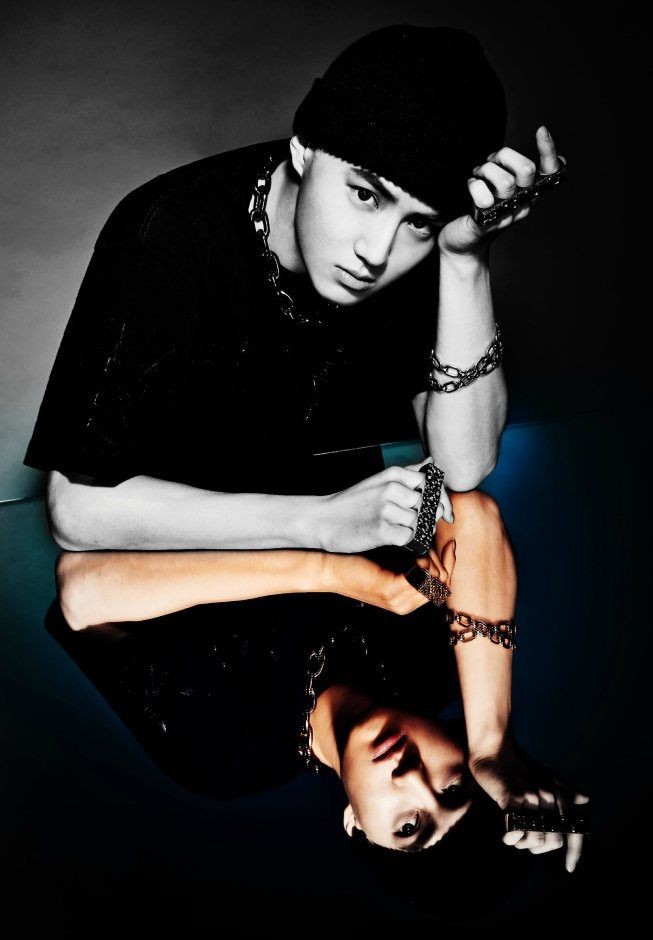 this is when suho and chen are next to enter, featuring and showing us here another version of their shoot during their overdose era. half of their pictures were covered in black, and everyone knows that black is the color of darkness. the struggle between good and evil.