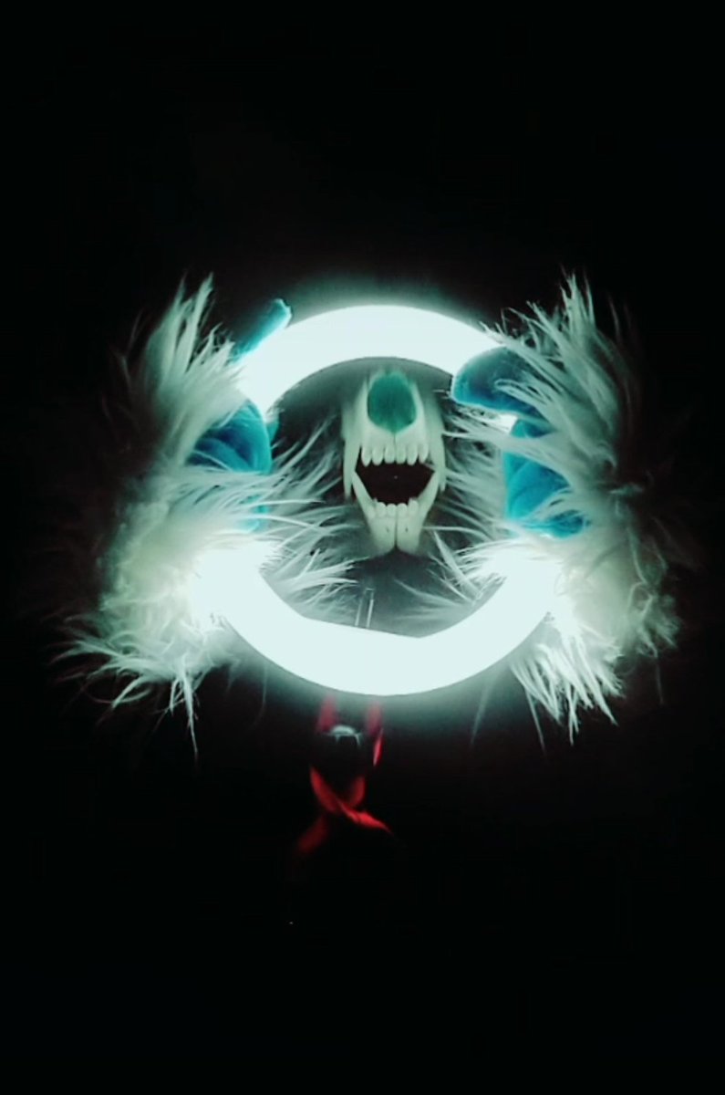 KWolfechild's tweet photo. Here are some strange fursuit pictures of my skull dog Cider, I really liked playing around with the ring light and the new rose props I got from a friend. 
#FursuitFriday #furry #fursuiting #photography https://t.co/0I5JdbSbnb