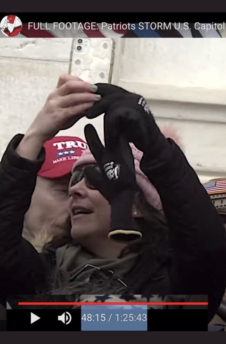 Note-  #Bullhornlady has blue fingernail polish, a small stud earring, distinctive gloves- can anyone see what is printed on them? Closeup of her iPhone cc  @jsrailton  @bellingcat  @Cleavon_MD