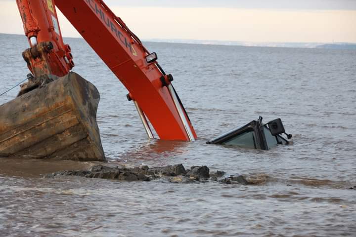 Hellsdec66's tweet photo. One digger consumed by the waves #Weston-super-Mare https://t.co/BT18num8EN