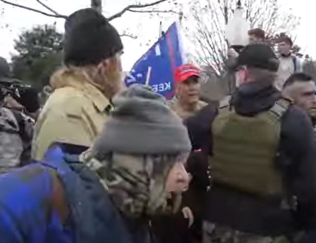  #breachteam6 Guy with glasses looking at  #bigmagacamo can also be seen in this footage talking to this very military looking guy  #gruntstyle. They also mention someone's name.  #tallglasses  #yellowtread   #SeditionHunters Show up later in the siege?