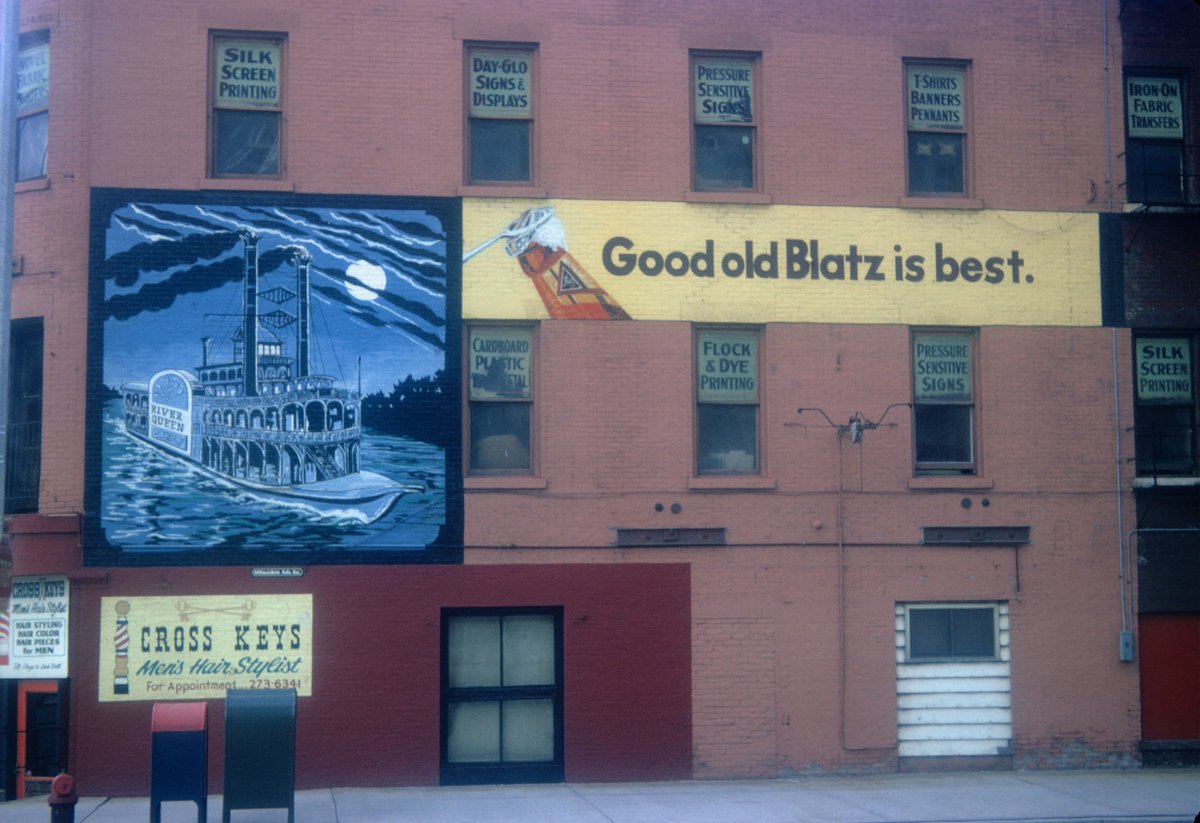The fire started on the first floor, consumed $200,000 in damages, and took 100 firefighters to extinguish. The famous River Queen mural was destroyed. No cause was ever determined. The corner of Water & St. Paul sat empty until the  @MKEPublicMarket opened May 2005. (10/)