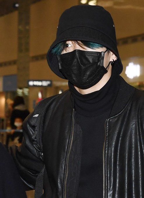 his blue hair peeking out