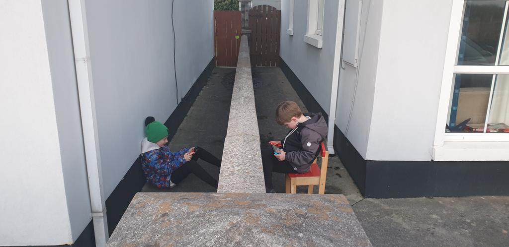 garquinn's tweet photo. Covid times. Two mates with a wall between them on switches. #COVID #SocialDistancing https://t.co/AcruQ1iKVq