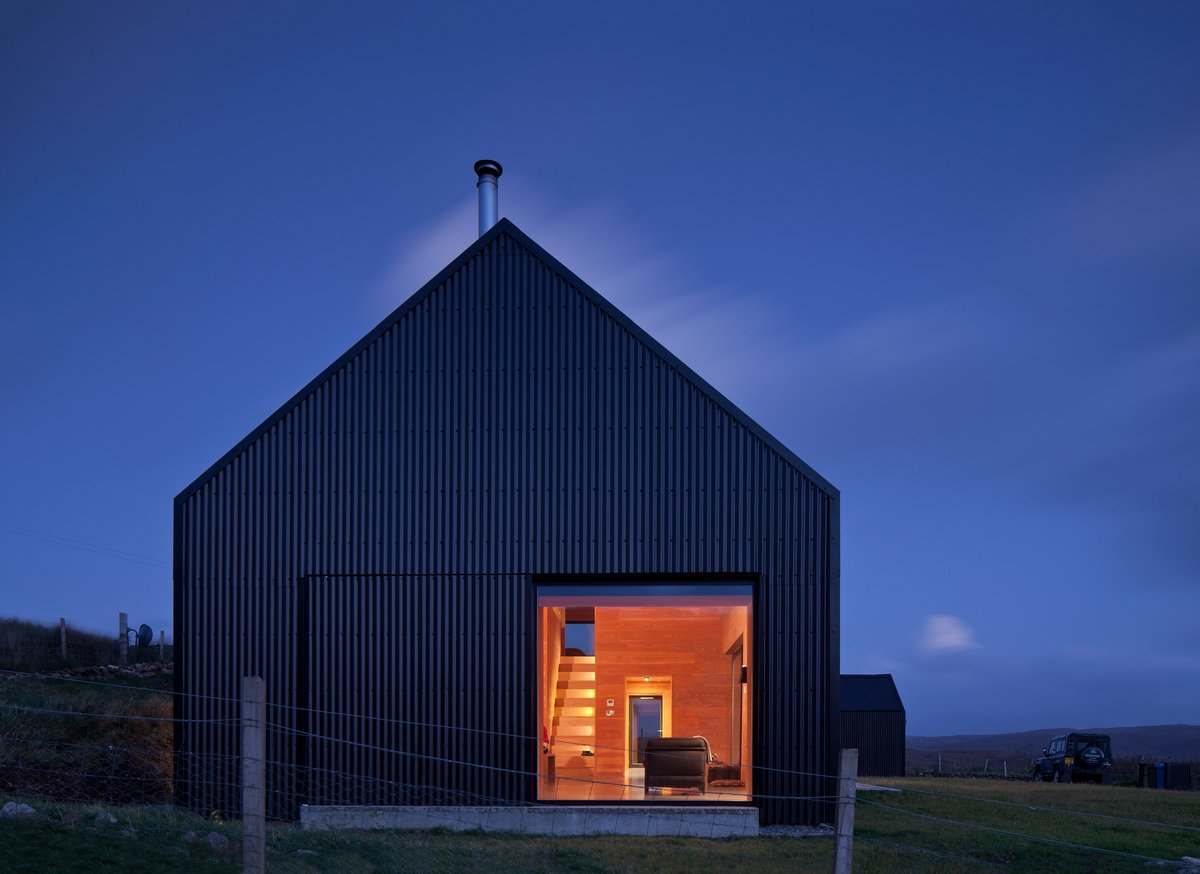 dezeen's tweet photo. This house on the Isle of Skye by @marnoldforster has fir interiors and a black tin exterior: https://t.co/gaKVXsGHJ8 https://t.co/QEOqOAVHt1