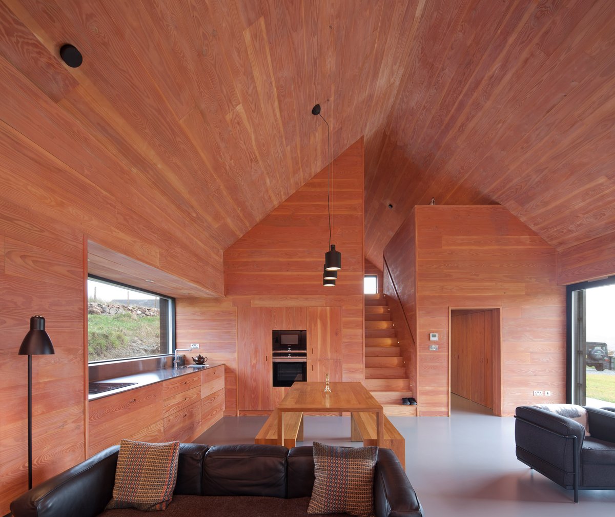 dezeen's tweet photo. This house on the Isle of Skye by @marnoldforster has fir interiors and a black tin exterior: https://t.co/gaKVXsGHJ8 https://t.co/QEOqOAVHt1