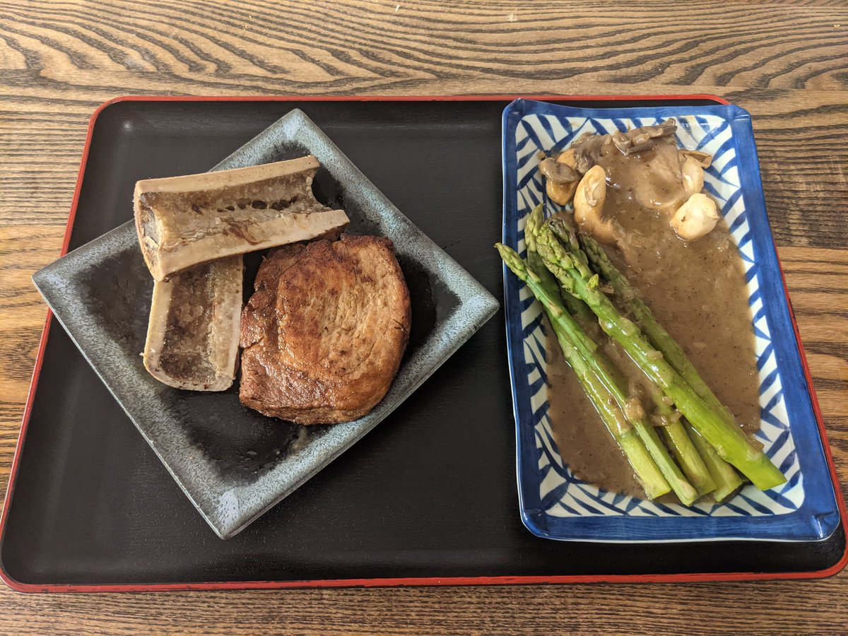 Pork chop with roast bone marrow, veggies and pan sauce
