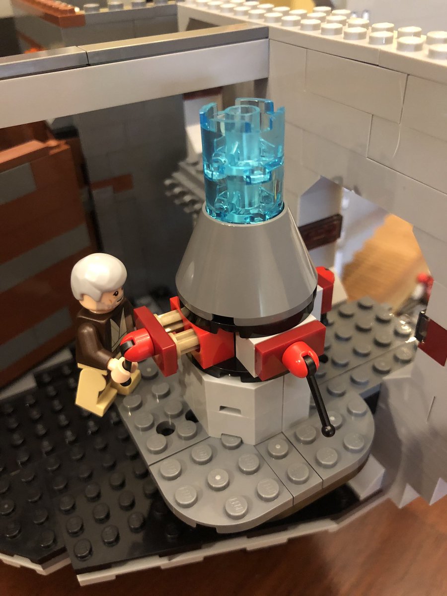 These blue pieces go inside the mechanism, and when Ben pulls the control out, they slide down. There’s a post that sticks through the bottom to push it back up.Also we have some garbage for the trash compactor.  #LEGO  