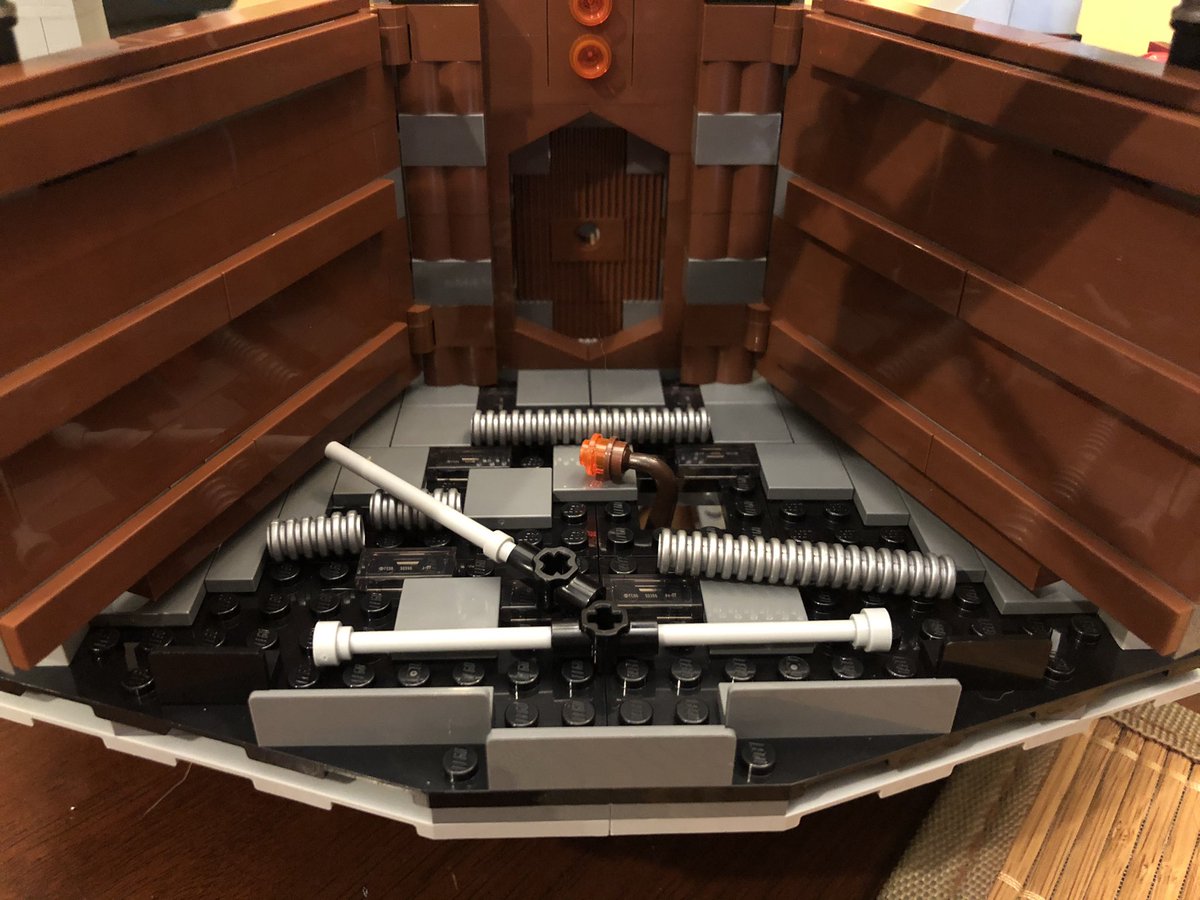 These blue pieces go inside the mechanism, and when Ben pulls the control out, they slide down. There’s a post that sticks through the bottom to push it back up.Also we have some garbage for the trash compactor.  #LEGO  