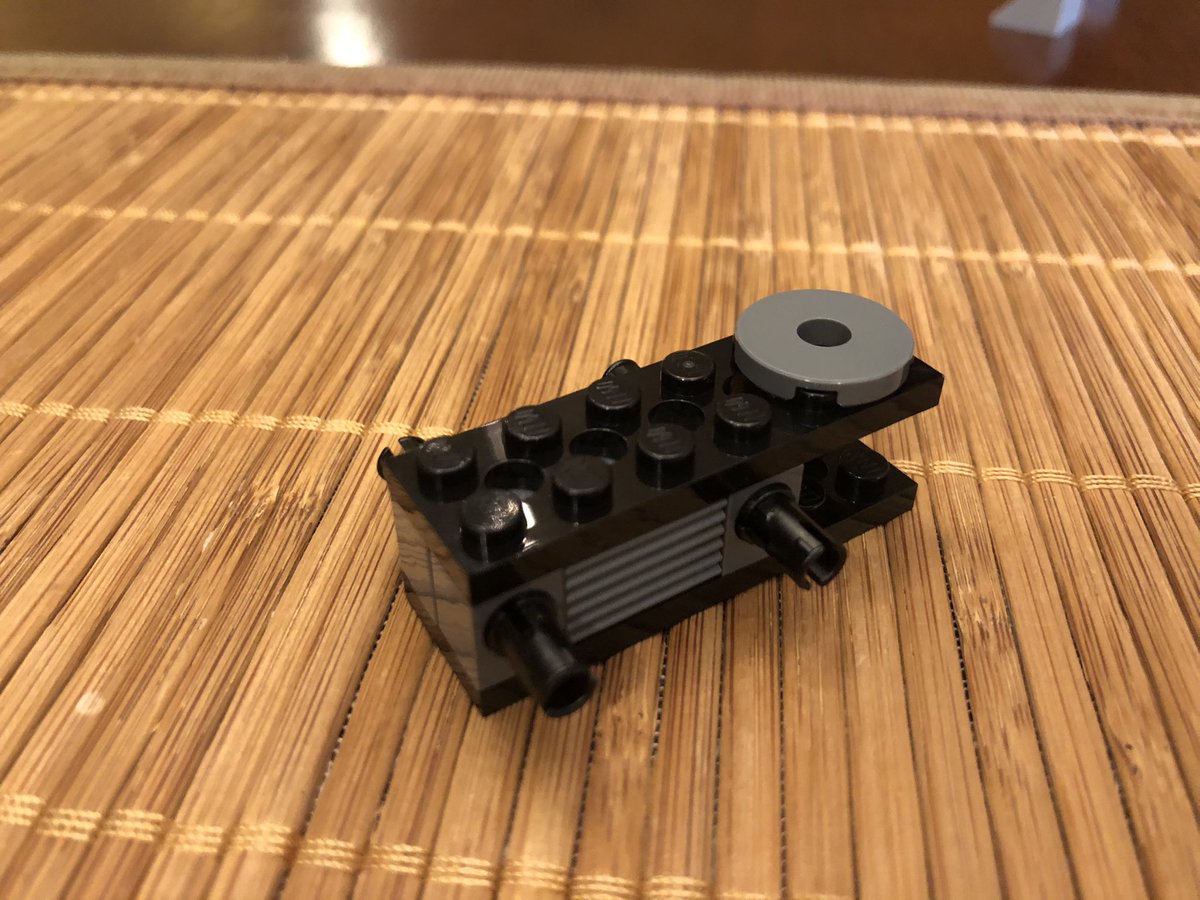 The next piece is an elevated platform. There’s a hole that goes the whole way through the gray circle.  #LEGO  