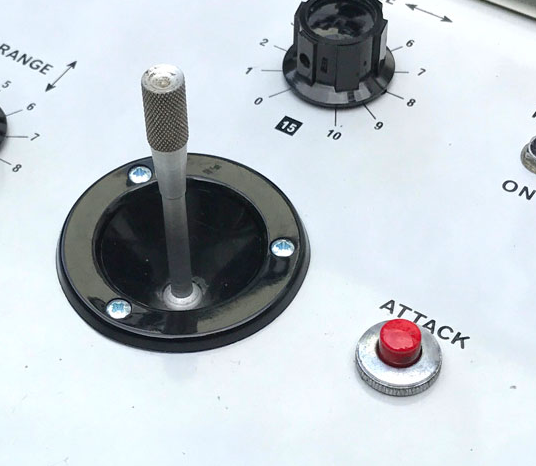 nitpick, but still relevant: they went with a generic black joystick. The attack button also appears to be board-mounted, where as the originals were panel-mount, with a nice chromed steel housing. The original joysticks were beautiful knurled aluminum affairs. a great detail.