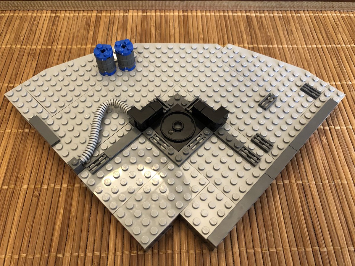 Some tubing and barrels go on top, then secure it counter clockwise of the previous floor. This is tricky because the compactor’s posts are in the middle of the floor. Take the time to secure all pieces snugly.  #LEGO  
