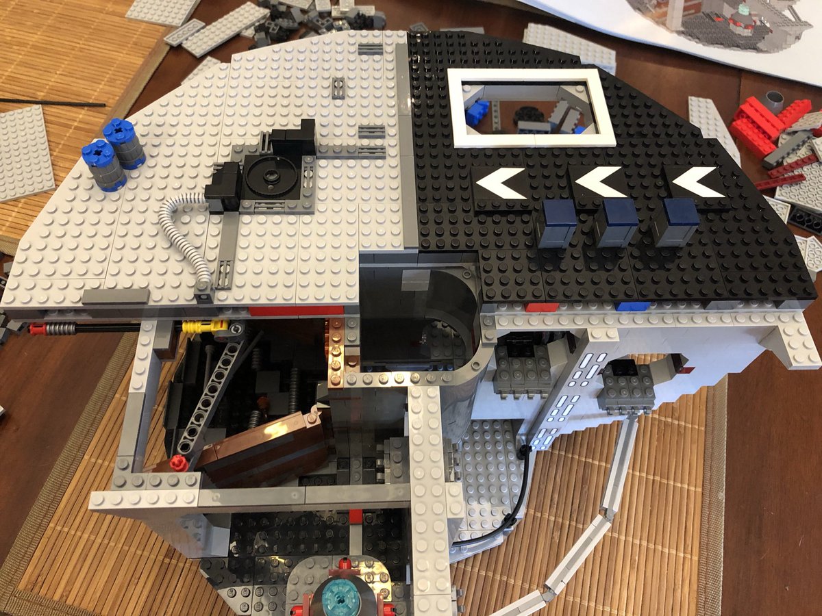 Some tubing and barrels go on top, then secure it counter clockwise of the previous floor. This is tricky because the compactor’s posts are in the middle of the floor. Take the time to secure all pieces snugly.  #LEGO  