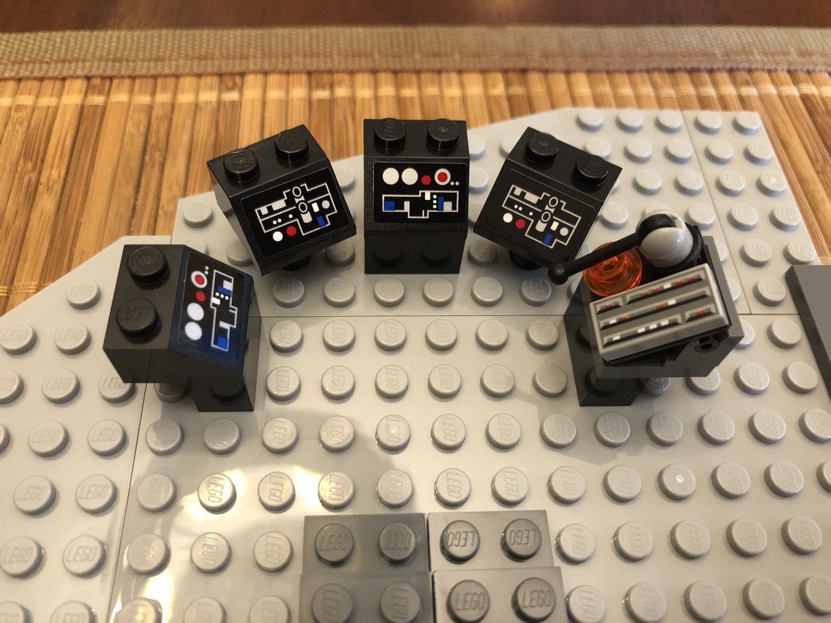 The third floor has a hole on one side. Some decoration goes on top, including some consoles and controls.  #LEGO  