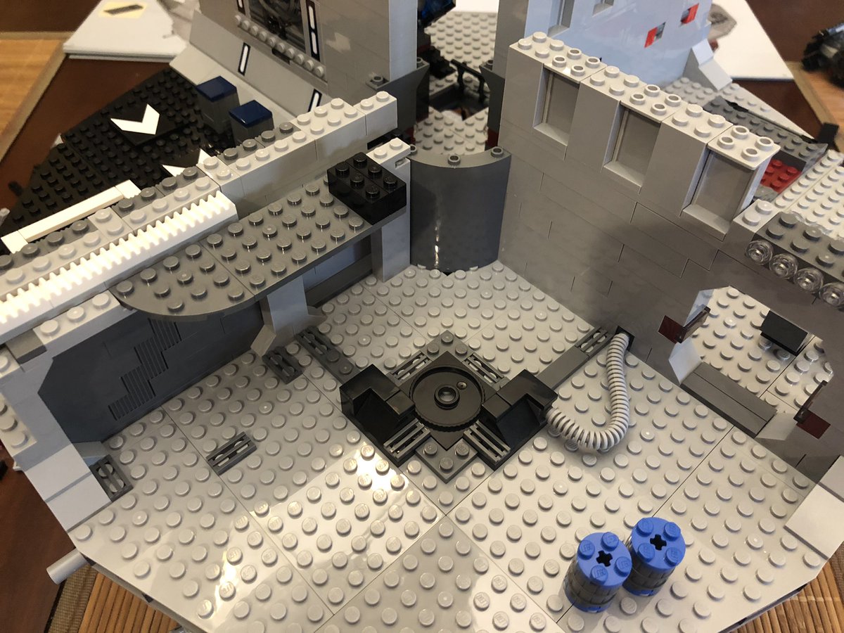 To place the mechanism. We need a second story, with a ladder to get up, and a set of consoles with the gear in the middle. Turn it to control the door below.  #LEGO  