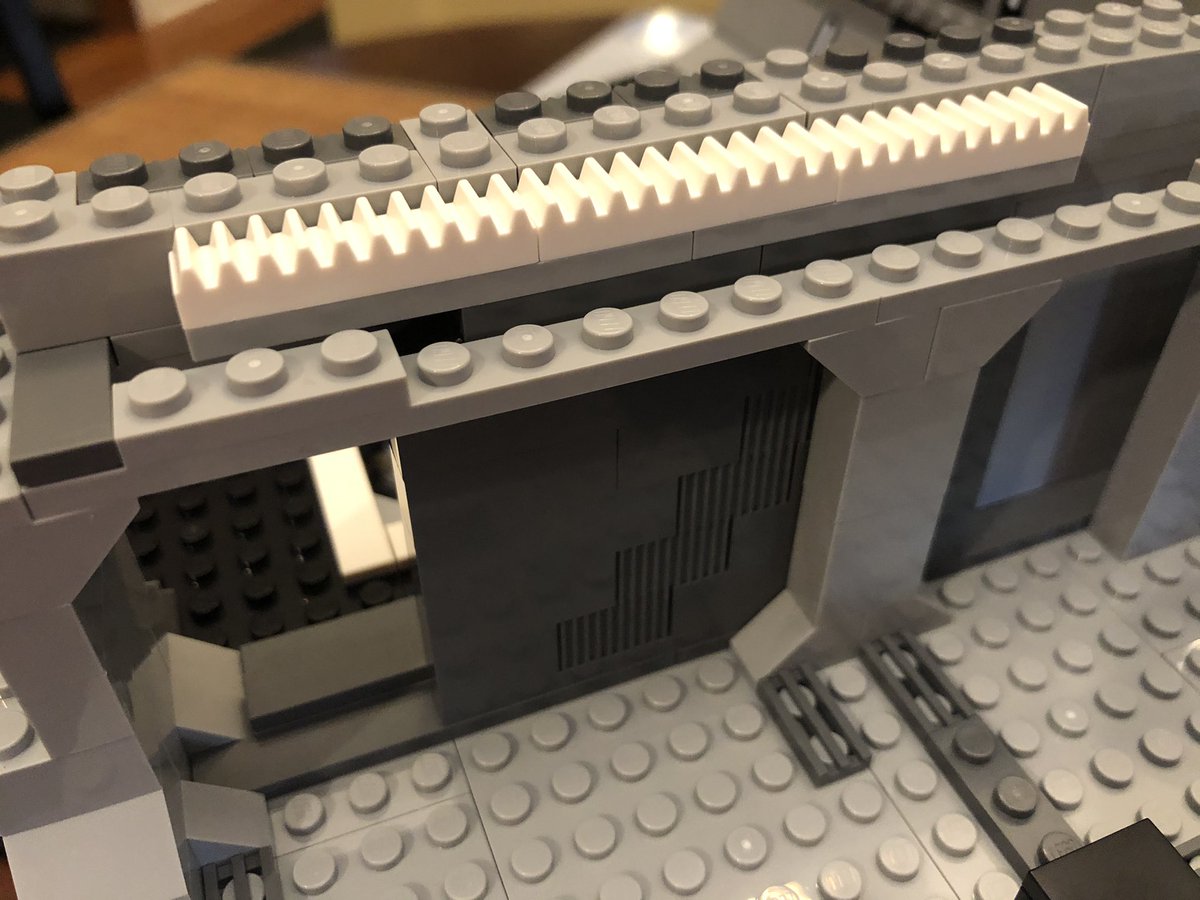 As we go, we find there’s a one block gap on the left side, and then we build a door that fits in the gap. There’s a little gear track on top, so it’s gonna have a mechanism later.  #LEGO  