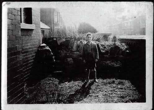 Young John Lennon being a model