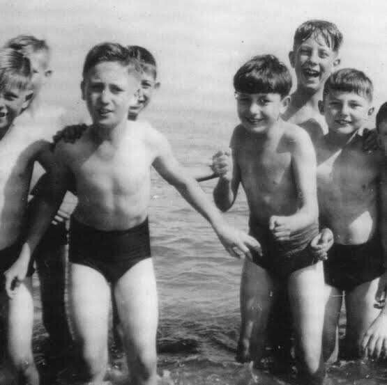 John Lennon playing in the water