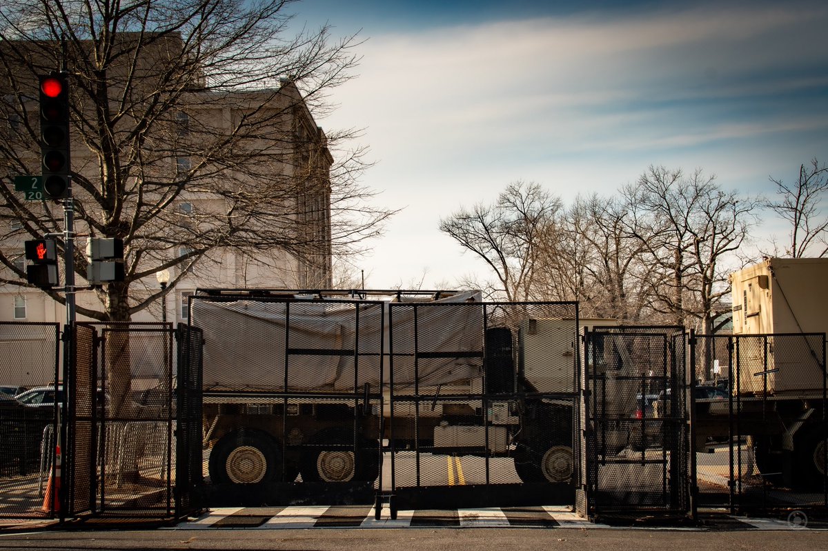 The fences were almost as high as the medium tactical vehicles they used to bar gateways, almost giving them the appearance of caged elephants. #DCLockdown  #BenjaPhoto