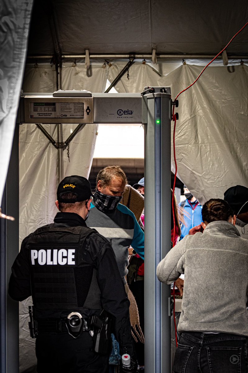 Makeshift checkpoints stood every few blocks, where armed guards went through every pocket of every knapsack, pocketbook, and jacket.We found out later a white supremacist got caught in one, with fake inauguration credentials and a gun. #DCLockdown  #BenjaPhoto