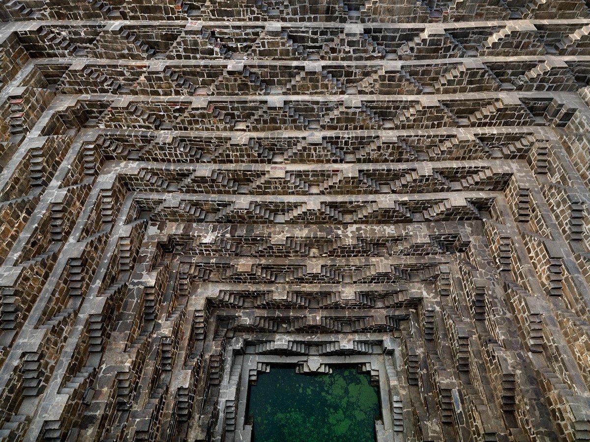 19.  Indian stepwells, also known regionally as 'vav', 'baori', 'baoli', and 'bawadi', are structures that, in the first place, helped harvest water but were also used as subterranean temples and pleasure retreats[Photographs by Edward Burtynsky and Victoria Lautman]