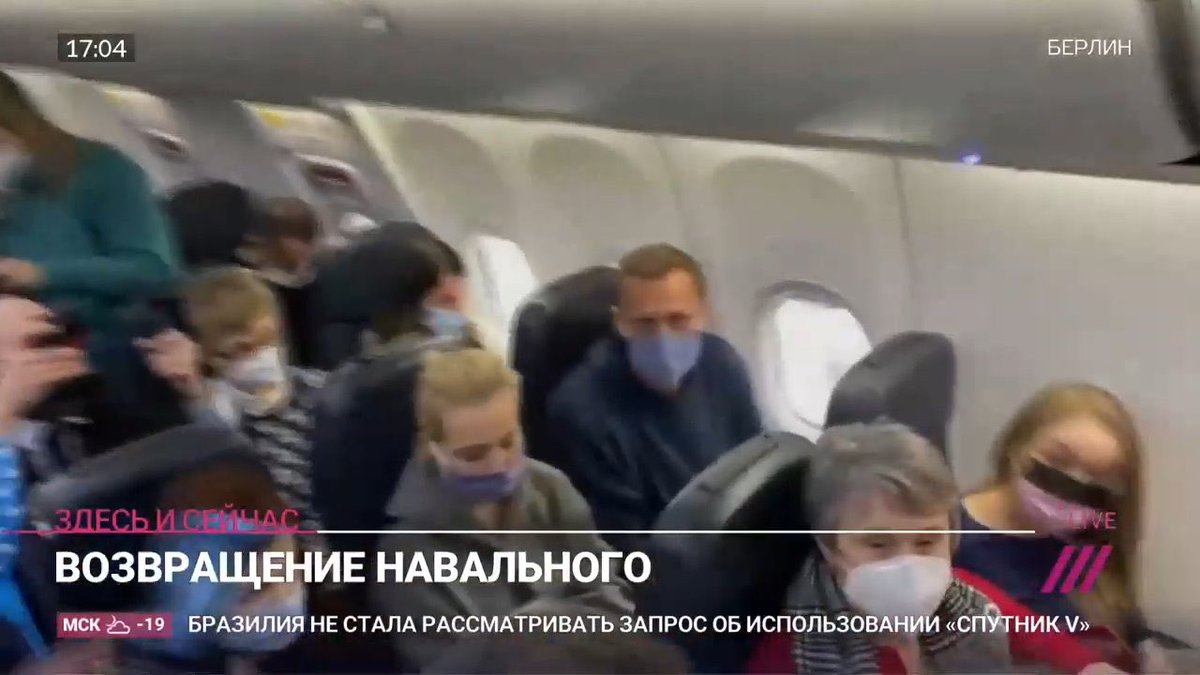 Navalny is on the plane back to Russia, where a huge phalanx of riot police awaits him.