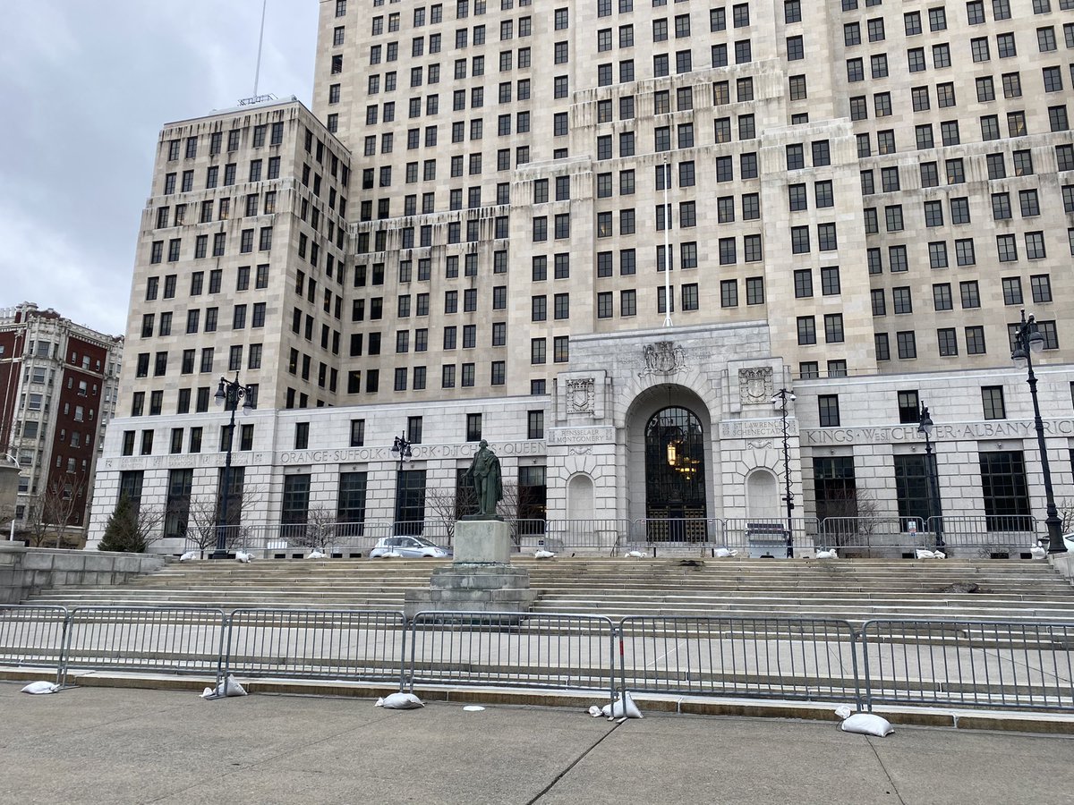 morganfmckay's tweet photo. Quite a few more barricades and fences around the NYS Capitol and surrounding buildings. Heavy police presence, including drones https://t.co/ZOWWLTuEyM