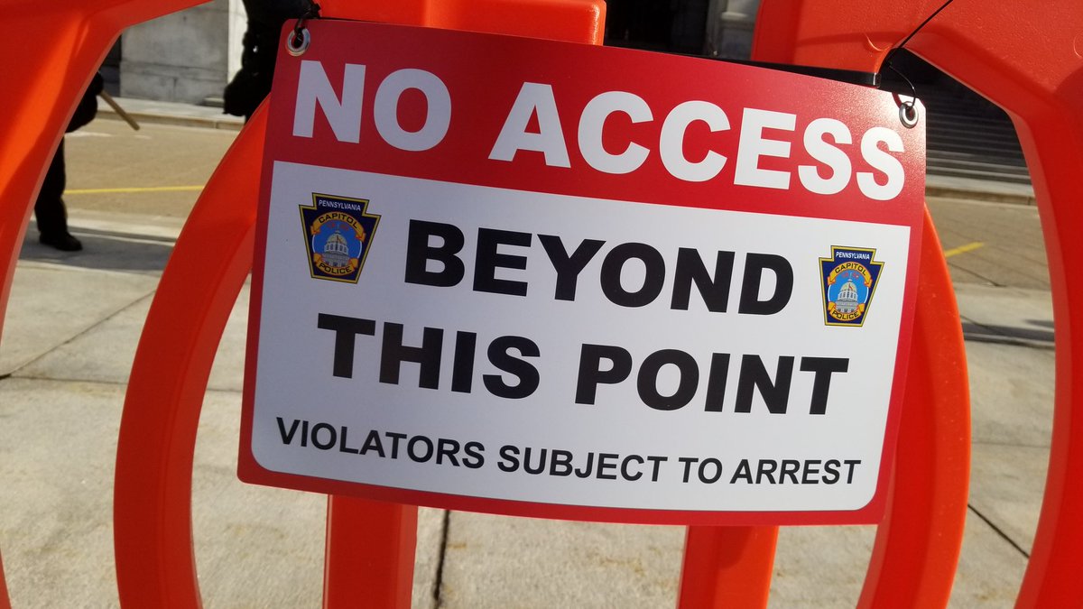 These are the signs on the temporary barriers in front of the Capitol