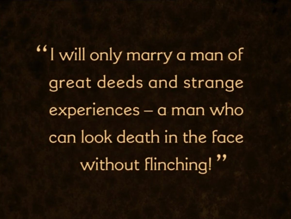 Watching a silent movie and boy does Gladys have high standards